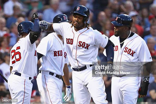 Hanley Ramirez of the Boston Red Sox celebrates with Jackie Bradley Jr. #25, David Ortiz and Xander Bogaerts after hitting a three run homer during...