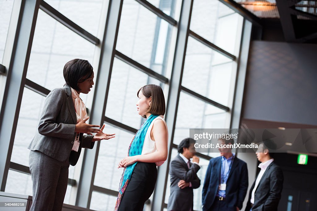 Business team consulting in the foyer at a conference