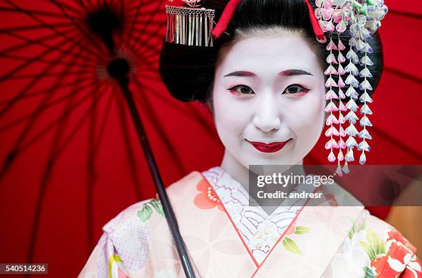 beautiful maiko girl smiling - geisha in training stock pictures, royalty-free photos & images