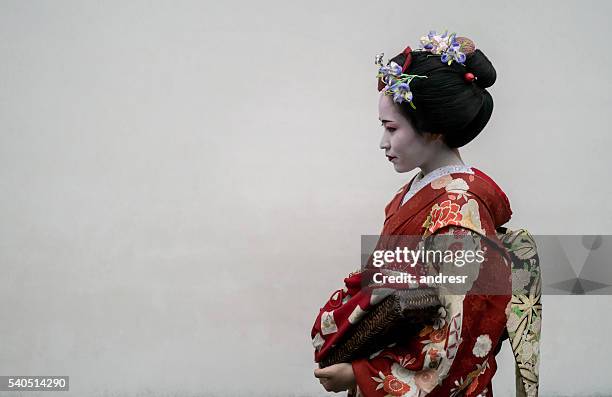 beautiful geisha wearing a kimono - geisha in training stock pictures, royalty-free photos & images