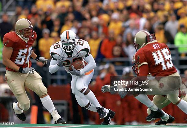 Clinton Portis of the Miami Hurricanes cuts upfield during the second half of Saturday's game between the Miami Hurricanes and the Boston College...