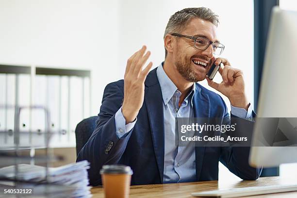 expanding his empire using technological resources - business person on phone stock pictures, royalty-free photos & images