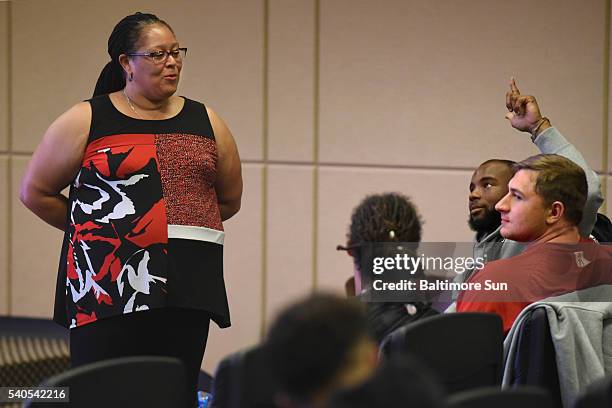 Dr. Tricia Bent-Goodley, the Baltimore Ravens' team clinician, presents a talk on "Total Wellness" to the team's rookies on June 9 in Owings Mills,...