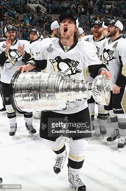 Carl Hagelin of the Pittsburgh Penguins celebrates with the Stanley Cup after the Penguins won Game 6 of the 2016 NHL Stanley Cup Final over the San...