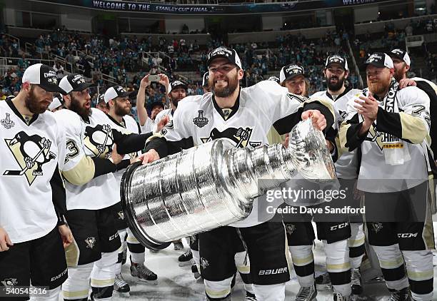 Ben Lovejoy of the Pittsburgh Penguins celebrates with the Stanley Cup after the Penguins won Game 6 of the 2016 NHL Stanley Cup Final over the San...