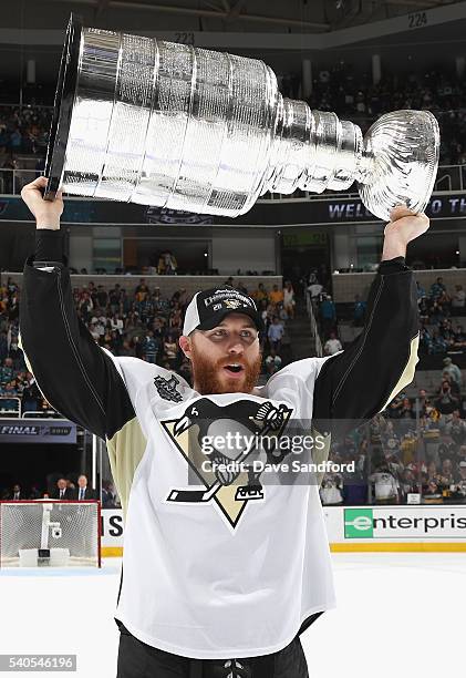 Ian Cole of the Pittsburgh Penguins celebrates with the Stanley Cup after the Penguins won Game 6 of the 2016 NHL Stanley Cup Final over the San Jose...