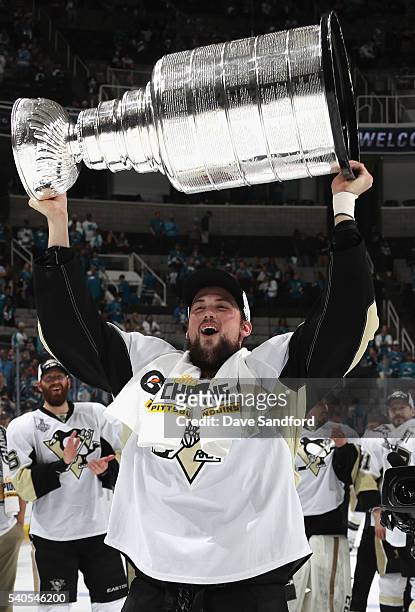 Brian Dumoulin of the Pittsburgh Penguins celebrates with the Stanley Cup after the Penguins won Game 6 of the 2016 NHL Stanley Cup Final over the...