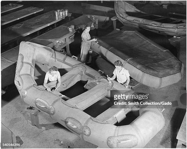 Women building assault boats for US Marine Corps during World War 2, 1941. Image courtesy National Archives. .
