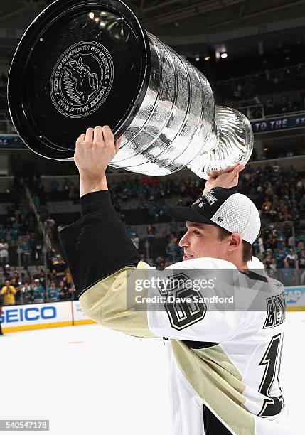 Beau Bennett of the Pittsburgh Penguins celebrates with the Stanley Cup after the Penguins won Game 6 of the 2016 NHL Stanley Cup Final over the San...