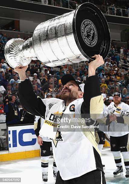 Kevin Porter of the Pittsburgh Penguins celebrates with the Stanley Cup after the Penguins won Game 6 of the 2016 NHL Stanley Cup Final over the San...