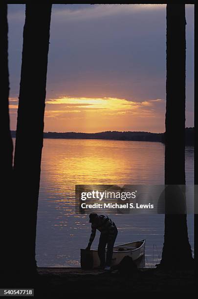 pulling canoe from pickerel lake - quetico provincial park stock pictures, royalty-free photos & images