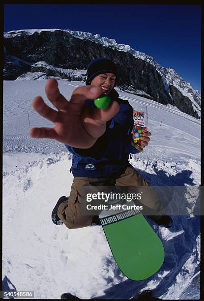 snowboarder showing green bubble gum - green bubble gum stock pictures, royalty-free photos & images