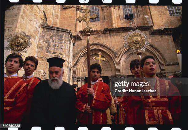 greek orthodox clergy performing the ritual of the washing of the feet - greek orthodox stock pictures, royalty-free photos & images