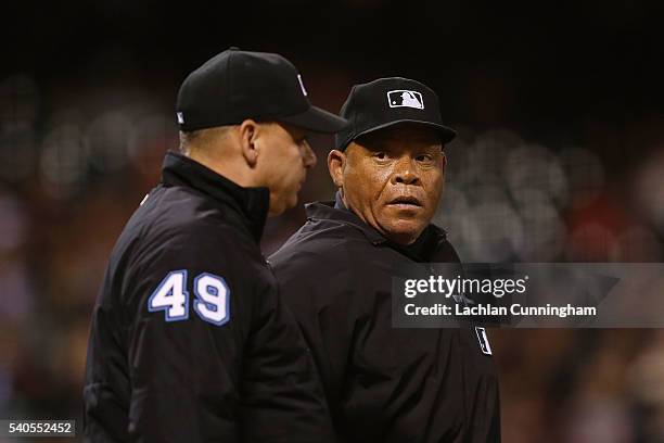 Home Plate umpire Kerwin Danley looks on after being hit by a pitch in the eighth inning of the game between the Milwaukee Brewers and the San...