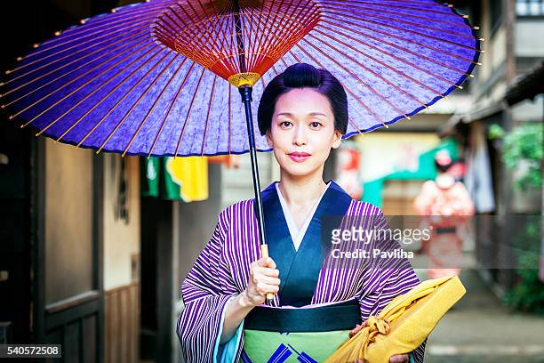 beautiful japanese woman with kimono in kyoto, japan - sports period stock pictures, royalty-free photos & images