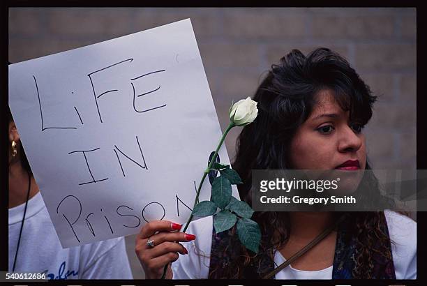 Selena fan holds a sign outside the courthouse in Houston, Texas where the slain singer's murder trail is being heard.