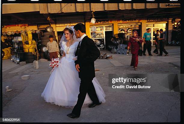 Irbil, Iraq: A couple just married, in their wedding attires.