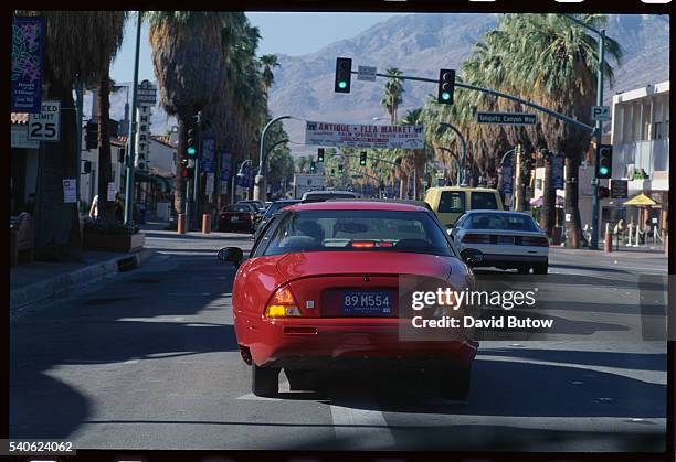 General Motors' environmentally friendly car, the EV1 , drives down a Palm Springs street.