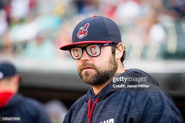 Joba Chamberlain of the Cleveland Indians wears a pair of novelty sunglasses while in the dugout prior to the game against the Kansas City Royals at...
