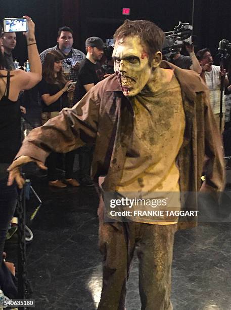 Walker from AMC series 'The Walking Dead' demonstrates how to be a zombie at a Walker Boot Camp at Universal Studios in Los Angeles, California on...