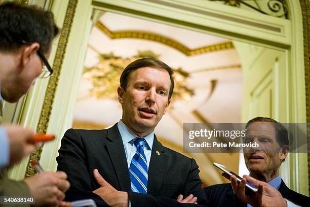 Senator Richard Blumenthal , , looks on as Senator Chris Murphy speaks to reporters after waging an almost 15-hour filibuster on the Senate floor in...