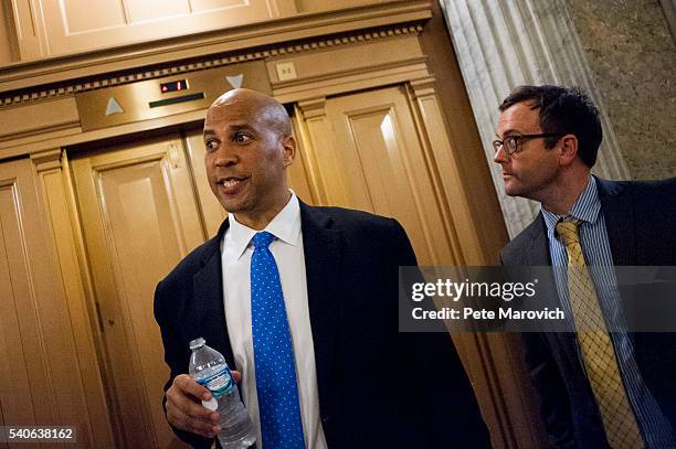 Senator Cory Booker looks for an elevator after assisting Senator Chris Murphy in waging an almost 15-hour filibuster on the Senate floor in order to...