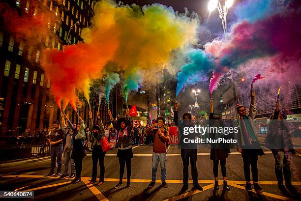 People attend a vigil in front of the Masp in Sao Paulo, Brazil on June 15 in reaction to the mass shooting at a gay nightclub in Orlando, Florida....