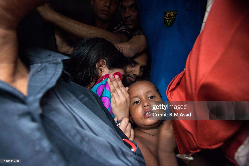 A child is crushed in an overloaded train as people are...