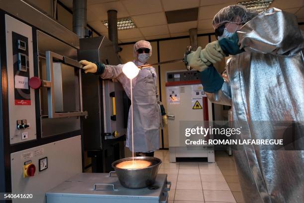 Noraker laboratory operator cools a molten mix of sodium carbonate, calcium carbonate, quartz and phosphorus pentoxide to prepare a bio-glass used to...