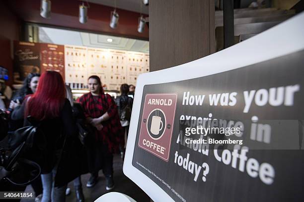 Customer feedback sign sits inside a branch of Arnold Coffee, operated by American Coffee Company SpA, in Milan, Italy, on Tuesday, April 12, 2016....