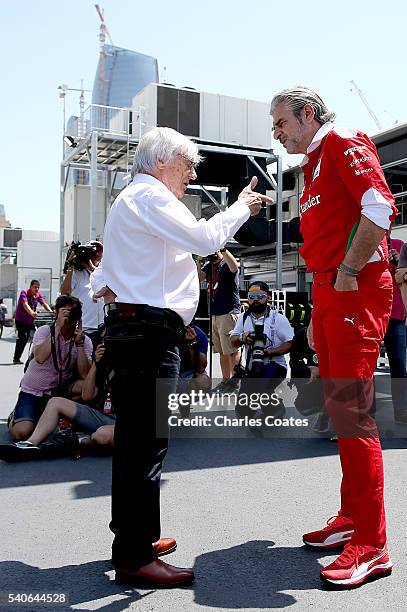 Supremo Bernie Ecclestone and Ferrari Team Principal Mautrizio Arrivabene talk in the Paddock during previews ahead of the European Formula One Grand...