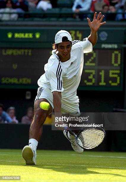 Nicolas Lapentti of Ecuador in action against Sjeng Schalken of the Netherlands during day three of the Wimbledon Tennis Championships at the All...