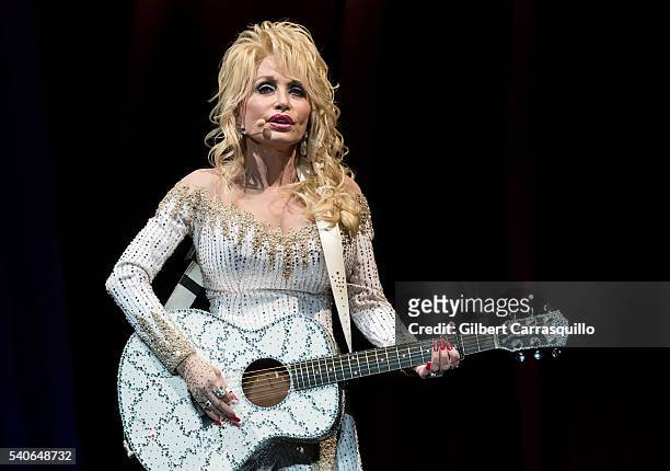 Singer-songwriter, actress, author, businesswoman Dolly Parton performs during Dolly Parton Pure & Simple Tour at Mann Center For Performing Arts on...