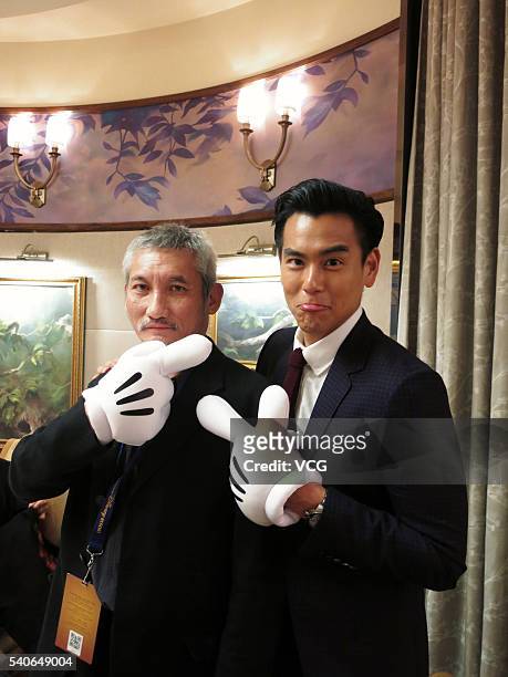 Director Tsui Hark and actor Eddie Peng arrive at Shanghai Disney Resort ahead of the opening ceremony on June 15, 2016 in Shanghai, China.