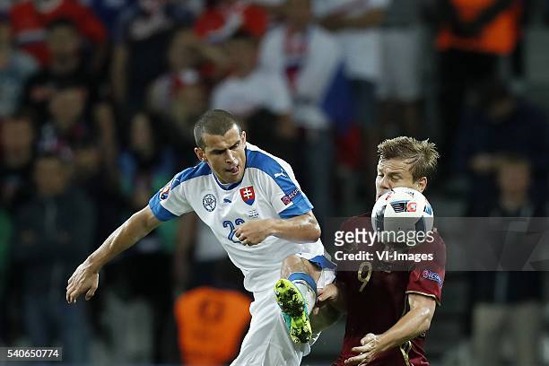 Viktor Pecovsky of Slovakia, Aleksandr Kokorin of Russia during the UEFA EURO 2016 Group B group stage match between Russia and Slovakia at the Stade...