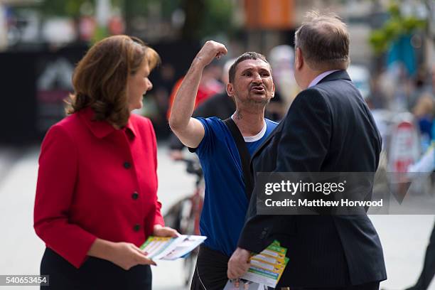 Plaid Cymru Leader Leanne Wood and former First Minister of Scotland Alex Salmond MP are shouted at by a member of the public during a rally on Queen...