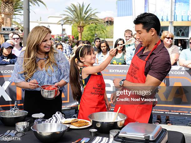 Ellamarie Fortenbach, Gia Francesca Lopez and Mario Lopez make waffles at "Extra" at Universal Studios Hollywood on June 15, 2016 in Universal City,...