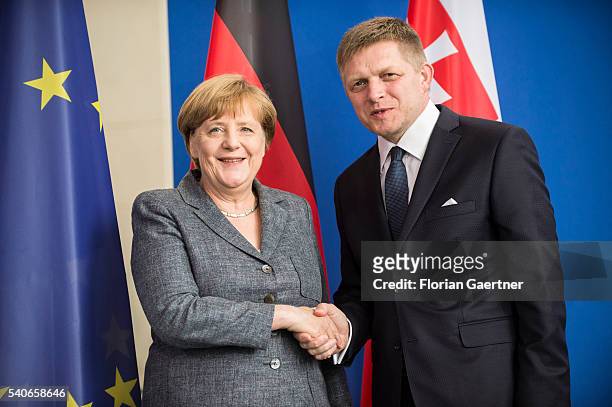 German Chancellor Angela Merkel and Robert Fico, Prime Minister of Slowakia, shake hands after their press conference on June 16, 2016 in Berlin,...