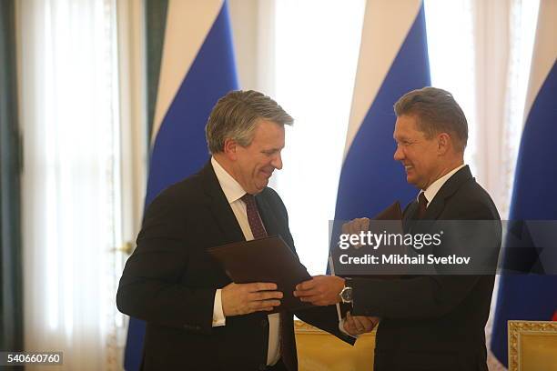 Russian Gazprom's CEO Alexei Miller greets Royal Dutch Shell CEO Ben van Beurden at the Konstantin Palace on June 16, 2016 in Saint Petersburg,...
