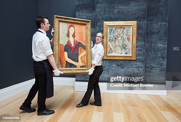 Masterpieces by Modigliani and Picasso unveiled at Sotheby's on June 16, 2016 in London, England. Modigliani's Jeanne Hebuterne , 1919 and Picasso's...