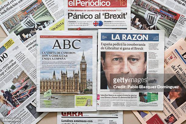 In this photo illustration, the Spanish newspaper ABC displays the cover headline 'La visita de Cameron hoy a Gibraltar enoja a Espana' and La...