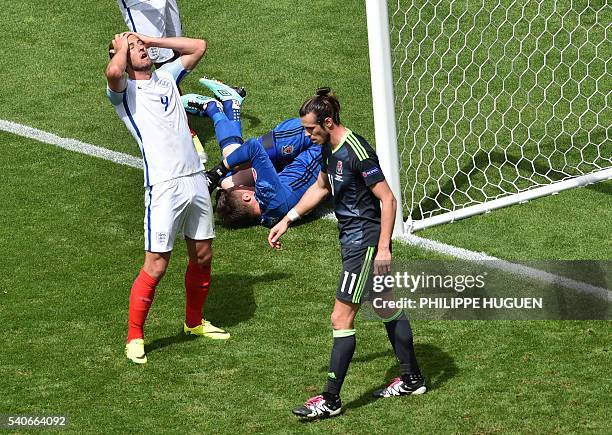 Wales' forward Gareth Bale walks past England's forward Harry Kane and Wales' goalkeeper Wayne Hennessey during the Euro 2016 group B football match...