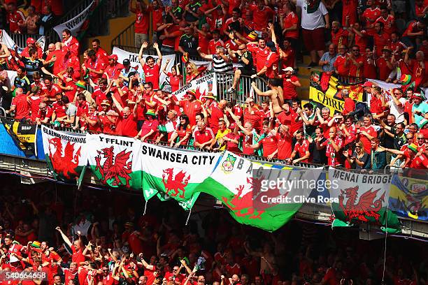 Wales fans celebrate their team's first goal during the UEFA EURO 2016 Group B match between England and Wales at Stade Bollaert-Delelis on June 16,...