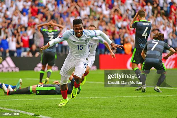 Daniel Sturridge of England celebrates scoring England's second goal during the UEFA EURO 2016 Group B match between England and Wales at Stade...