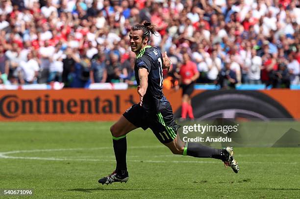 Gareth Bale of Wales celebrates scoring a goal during the UEFA Euro 2016 Group B match between England and Wales at Stade Bollaert-Delelis in Lens,...
