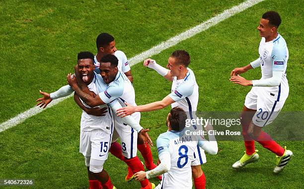 Daniel Sturridge of England celebrates scoring his team's second goal with his team mates during the UEFA EURO 2016 Group B match between England and...