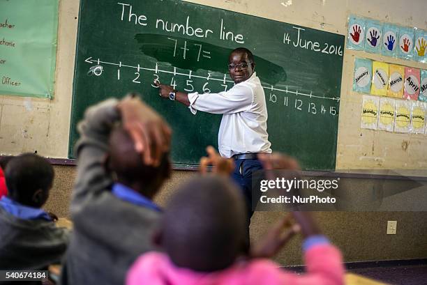Teacher Richard Tjaronda shows easy way of counting with the number line for his learners during Mathematic lesson at Eluwa Special School in...