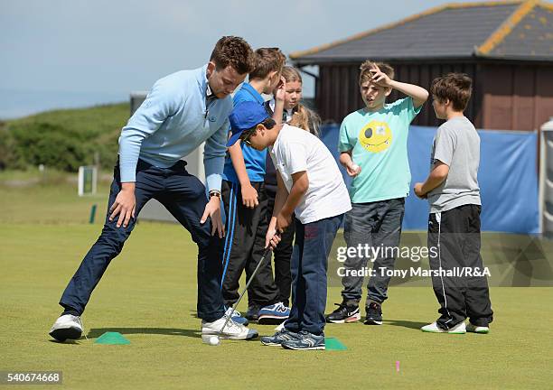 Young players take part in the junior golf clinic during The Amateur Championship 2016 - Day Four at Royal Porthcawl Golf Club on June 16, 2016 in...