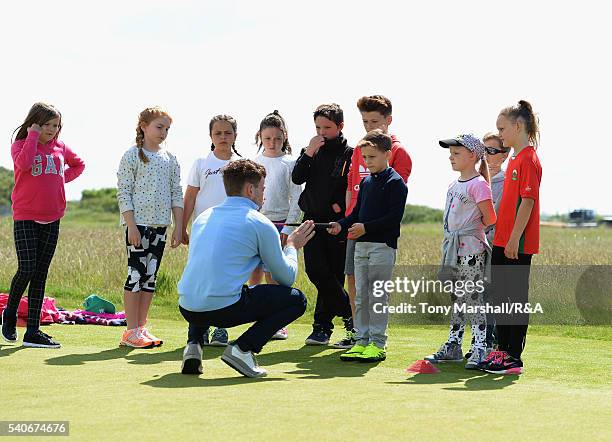 Young players take part in the junior golf clinic during The Amateur Championship 2016 - Day Four at Royal Porthcawl Golf Club on June 16, 2016 in...