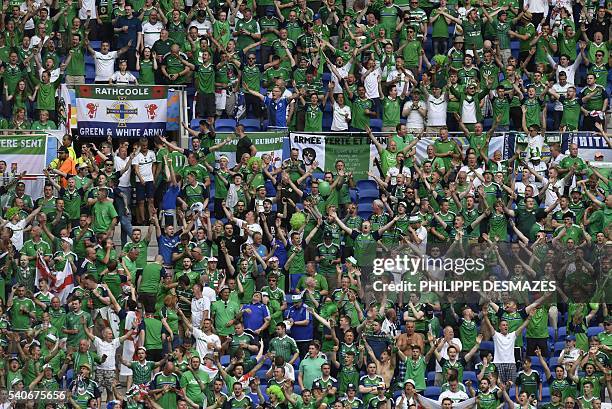 Northern Ireland supporters cheer before the Euro 2016 group C football match between Ukraine and Northern Ireland at the Parc Olympique Lyonnais...